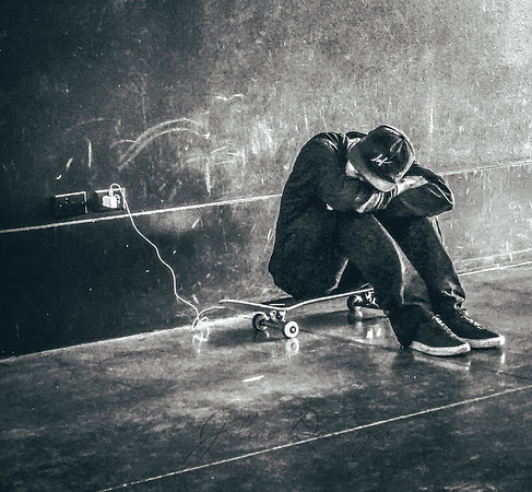Skateboarder resting