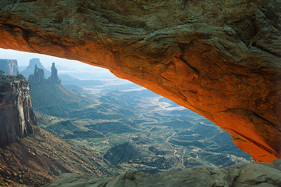 Arches National Park with the arch lit by the setting sun